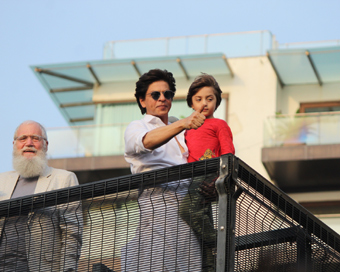 Mumbai: Actor Shahrukh Khan and his son AbRam Khan during a fan meet from the balcony of Mannat on Eid-ul-Fitr celebrations, in Mumbai, on June 5, 2019. (Photo: IANS)