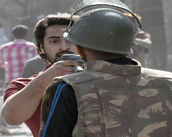 Sharukh pointing gun at police