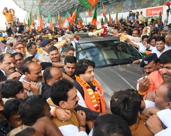 Bhopal: Jyotiraditya Scindia who resigned from the Congress and joined the BJP on Wednesday, receives warm welcome on his arrival at the Raja Bhoj Airport in Bhopal on March 12, 2020. (Photo: IANS)