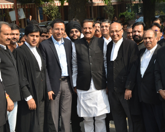 New Delhi: Senior advocate Abhishek Manu Singhvi, Congress leaders Prithviraj Chavan and Randeep Singh Surjewala after an unprecedented hearing at the Supreme Court on the brewing political drama in Maharashtra, in New Delhi on Nov 24, 2019. (Photo: 