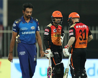 Saha, Warner maul Mumbai Indians to storm into playoffs 