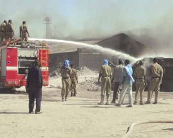 Khartoum: This Tuesday, Dec. 3, 2019 image taken from video, firefighters try to put out a fire at a tile factory in Khartoum, Sudan. A gas tanker had abruptly caught fire and exploded, destroying the factory.  Several were killed and hundreds were i