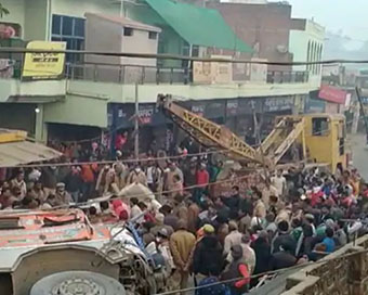 Truck overturns on car 