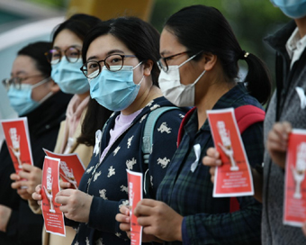 Coronavirus: Hong Kong medics strike to urge China border closure