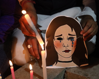 New Delhi: Youth Congress activists participate in a candlelight vigil to protest against the death of Unnao rape victim, highlighting the rise in incidents of crimes against women, in New Delhi on Dec 7, 2019. (Photo: IANS)