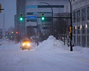 Death toll rises to 57 as big freeze grips US