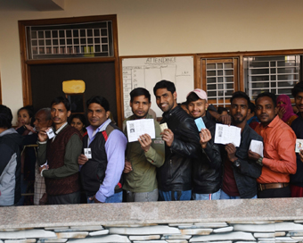New Delhi: People queue up at a polling station in East Delhi to cast their votes for the Delhi Assembly elections 2020 on Feb 8, 2020. (Photo: IANS)