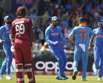 India thrash Windies to put one foot in the WC semis