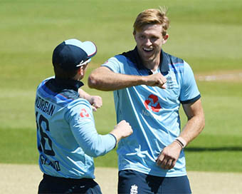 Eoin Morgan and David Willey celebrating a wicket