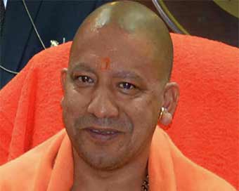 EC ban on: Yogi lands in Ayodhya temple, meets saints